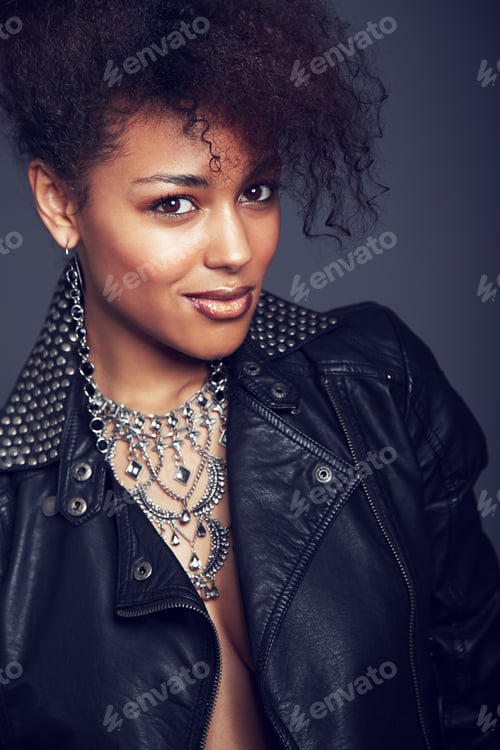 Preview: In touch with the latest trends. A gorgeous young trendy woman looking at the camera.