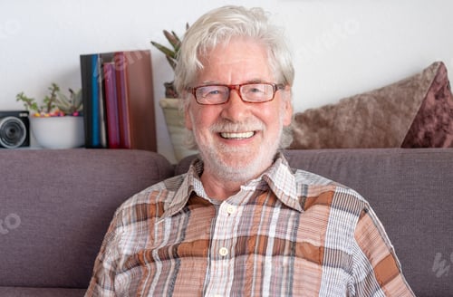 Preview: portrait of smiling adult beautiful senior bearded man wearing eyeglasses and checkered shirt
