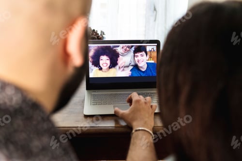 Preview: Friends smiling during a video call.