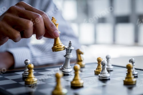 Preview: Businessman playing chess game reaching to plan a strategy for success, thinking for planning overco
