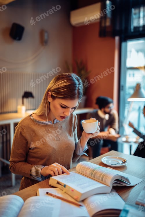 Preview: Woman Studies with Coffee in Airy Cafe