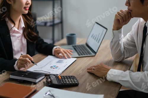 Preview: Business executive reading finance document to brainstorming about new startup project with partner