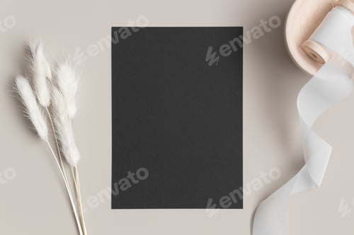 Preview: Black invitation card mockup with a lagurus on a beige table. 5x7 ratio, similar to A6, A5.