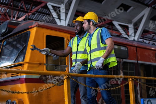 Preview: Mechanics walking around on platform train cars together during maintenance and auto service garage