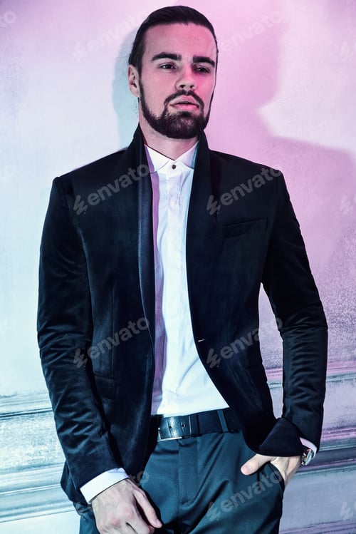 Preview: Portrait of young handsome man posing in studio