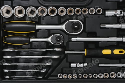 Preview: New square black tool box on wooden texture background. Top view.