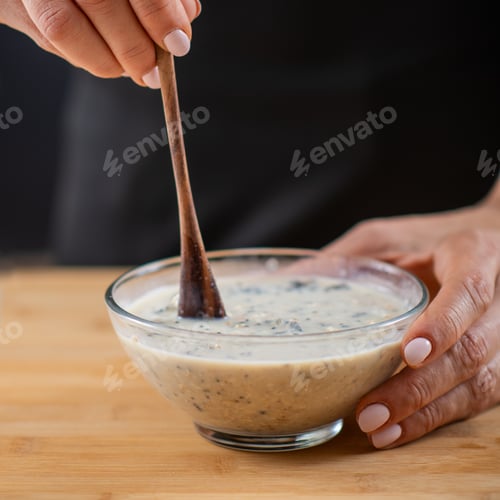 Preview: Oatmeal preparation featuring oats, soy milk, and plant protein powder,
