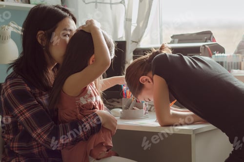 Preview: Mother and daughters draw together at home, authentic family life and candid lifestyle in apartment