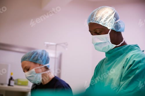 Preview: Surgical Team Working On Patient In Hospital Operating Theatre