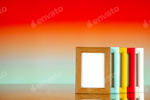 Preview: front view different picture frames with colored corners on light red background picture family