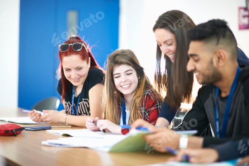Preview: Teacher in classroom helping students study