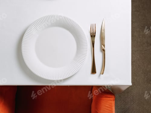 Preview: Table settings with empty white plate, copy space