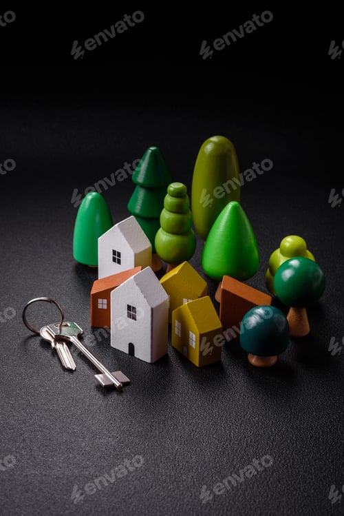 Preview: A small wooden house and keys as an idea for investing in your own home