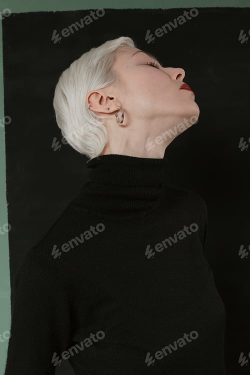 Preview: Beautiful Emotional Girl With White Hair On A Black Background