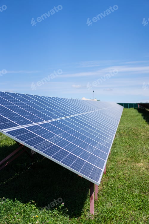 Preview: Solar batteries power station located in a field.