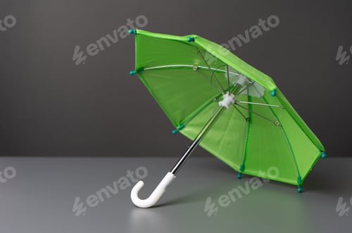 Preview: Green umbrella on a sign. Insurance and protection concept.
