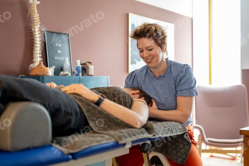 Preview: Chiropractor working on a patient in a clinic