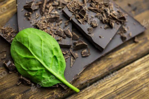 Preview: Close up view of chocolate with basilica on a wooden table