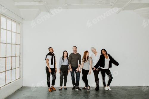 Preview: Group of Coworkers Standing Together in Office