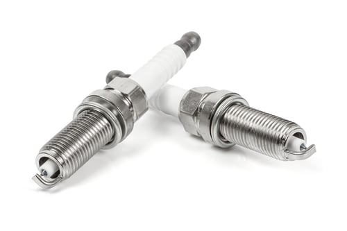 Preview: Close Up of Two Spark Plugs on White