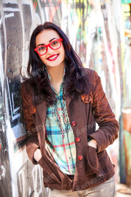 Preview: Teen girl near graffiti wall.