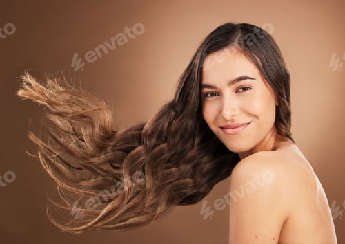 Preview: Hair, beauty and portrait of woman in studio for wellness, hairstyle treatment and health on brown