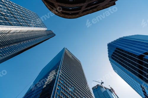 Preview: Low angle shot of the modern glass buildings and skyscrapers on a clear day