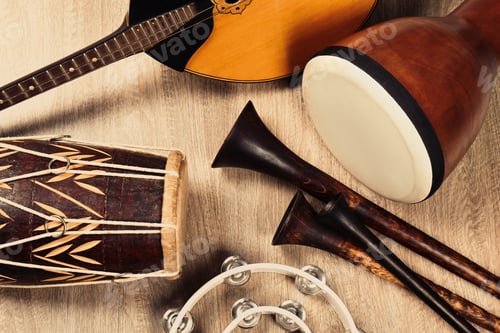 Preview: Set of different vintage musical instruments on wooden background, flat lay