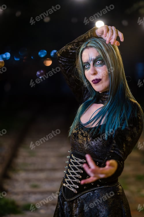 Preview: Portrait of a hot woman in a gothic costume posing outdoors at night