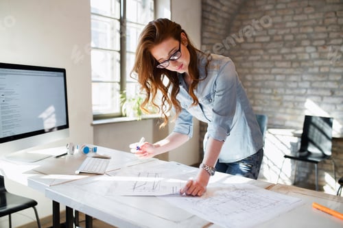 Preview: Portrait of young female architect working on project