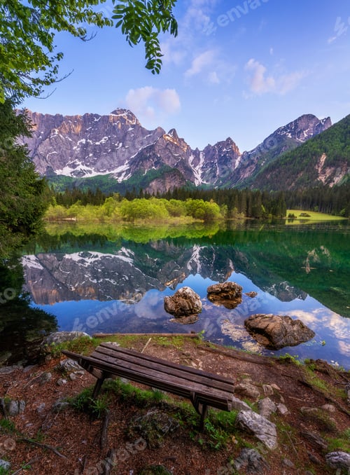 Preview: Mangart lake at sunset and mountains reflection