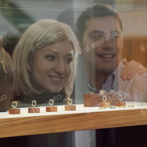 Preview: reflection of couple on shop window