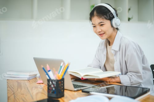 Preview: Teenage Asian students wearing a headphone are communicating