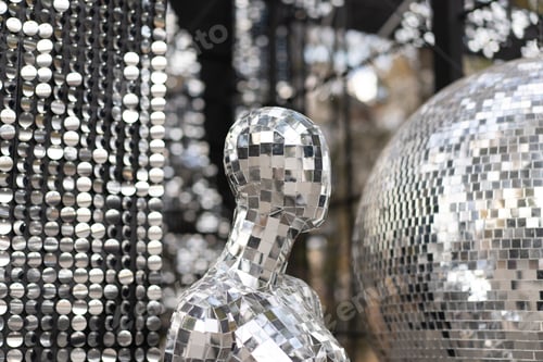 Preview: Male mannequin covered with slices of a mirror on a black background mr disco