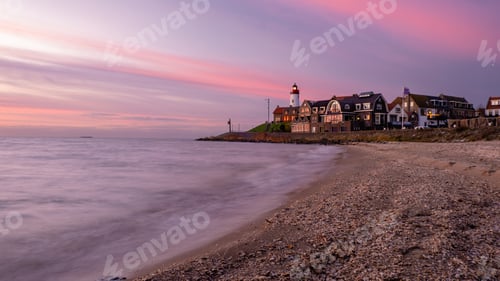 Preview: Urk Flevoland Netherlands sunset at the lighthouse and harbor of Urk Holland