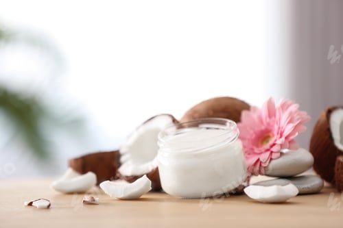 Preview: Composition with coconut butter in glass jar on blurred background