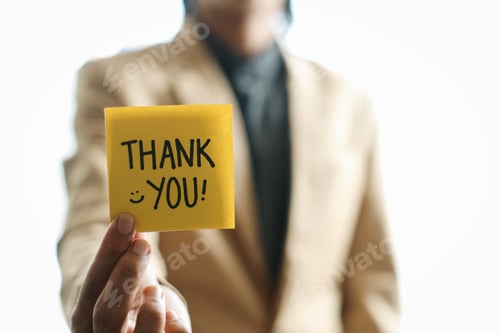 Preview: Businessman Holding Thank You Written On Sticky Note.