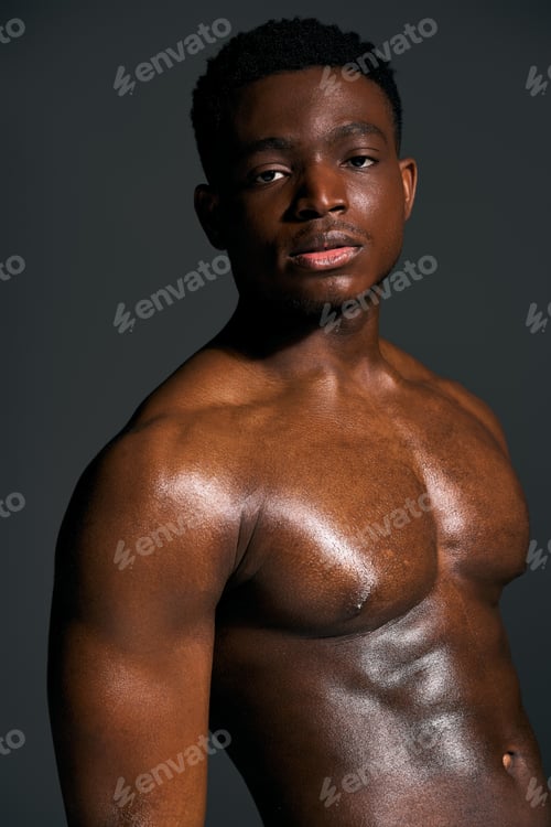 Preview: Young handsome African American man poses confidently with a strikingly toned physique