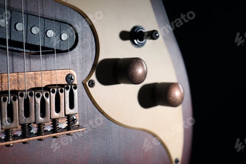 Vista previa: Modern electric guitar in darkness, closeup view