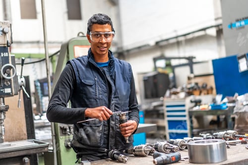 Preview: Latino worker in the metal industrial factory trade in the numerical control sector