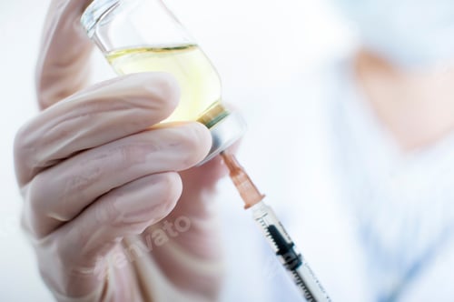 Preview: doctor draws medicine into a syringe close-up