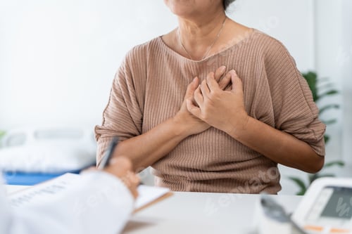 Preview: Senior woman having chest pain during medical consultation