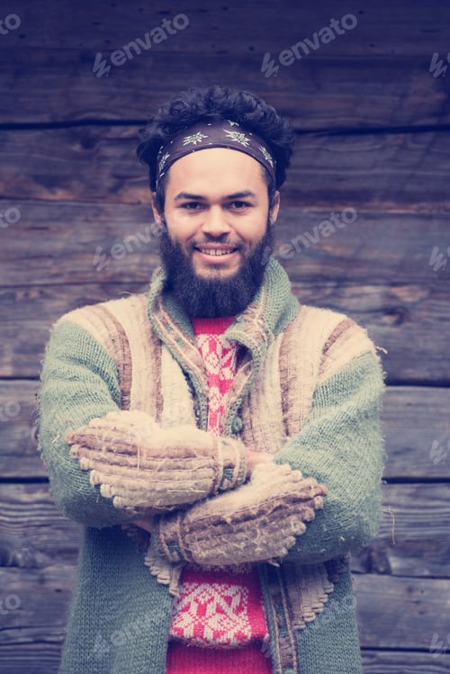 Preview: portrait of young hipster in front of wooden house