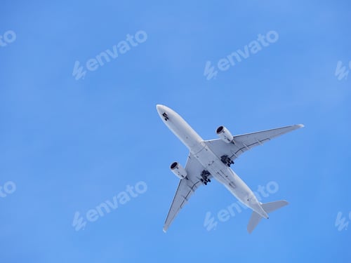 Preview: Plane in blue sky and space for text.