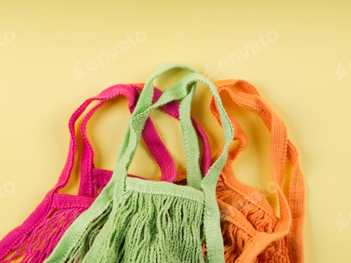 Preview: Reusable cotton mesh bags on yellow background.