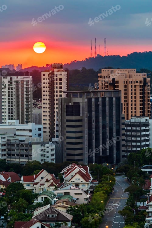 Preview: The sun setting behind Bukit Timah Hill in Singapore this evening.