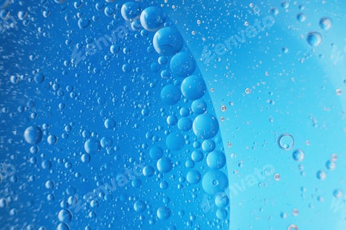Preview: abstract light blue background with oil circles . bubbles of water close up .