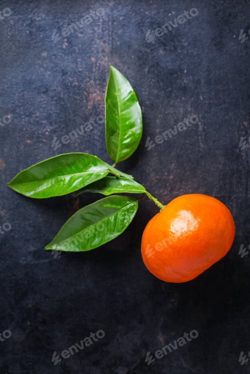 Preview: Citrus fruits tangerine on a grunge black table