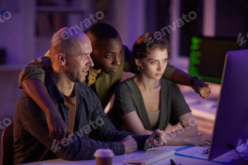 Preview: Three People Co-working In Office