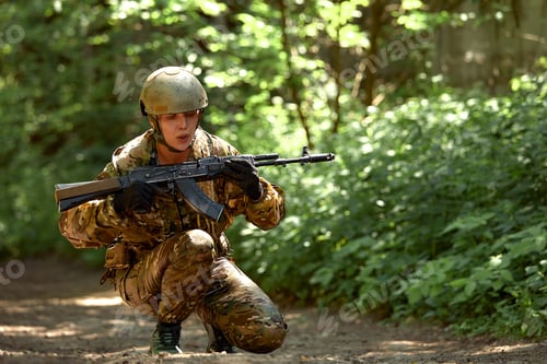 Preview: Special forces soldier with weapon take part in military maneuver. War, army, technology and people